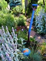 Art can add whimsy and color to your garden.